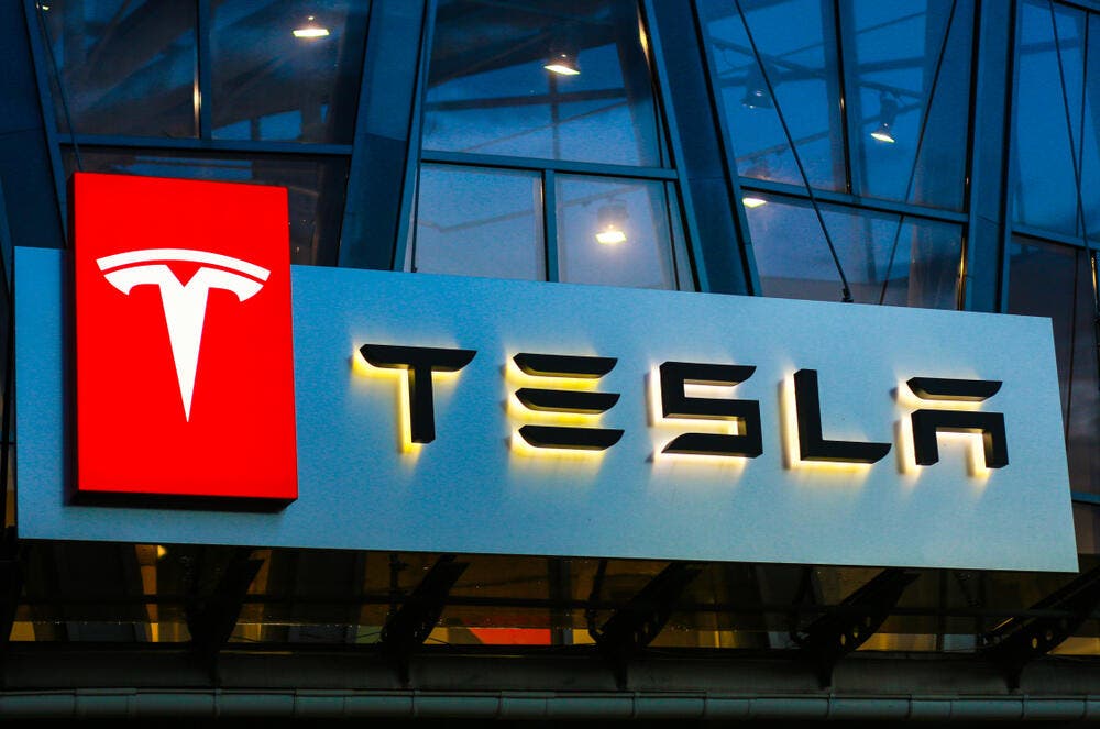 tesla reports revenues expectations earnings